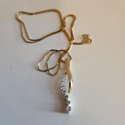 Sale Photo Thumbnail #249: This auction lot is for a 14K Gold & Diamond Necklace.  The necklace measures about 24-inches and is marked 14K. The stunning pendant is marked 14K and has eight chip stones tested as diamond.  This nifty item weighs about 5.1 grams by our scale.