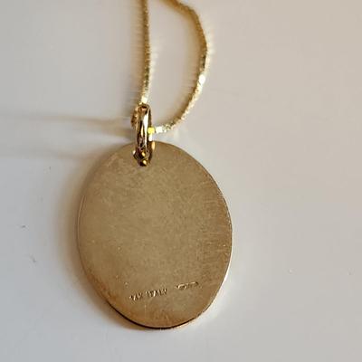 Sale Photo Thumbnail #253: This auction lot is for a 14K Gold Necklace with Madonna Medal.  The chain measures about 18-inches long and is marked 14K. The Madonna Medal is marked 14K.  The necklace with medal weighs about 3.1 grams by our scale.  Quite a nice and delicate religious