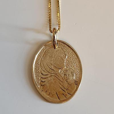 Sale Photo Thumbnail #252: This auction lot is for a 14K Gold Necklace with Madonna Medal.  The chain measures about 18-inches long and is marked 14K. The Madonna Medal is marked 14K.  The necklace with medal weighs about 3.1 grams by our scale.  Quite a nice and delicate religious