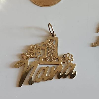 Sale Photo Thumbnail #258: This auction lot is for a Grouping of 14K Gold Charms.  Each of the five charms is marked 14K.  The grouping weighs about 3.6 grams on our scale. Use as the group or gift them out to your family and friends.