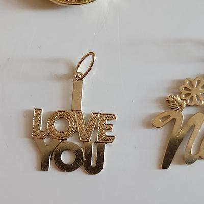 Sale Photo Thumbnail #259: This auction lot is for a Grouping of 14K Gold Charms.  Each of the five charms is marked 14K.  The grouping weighs about 3.6 grams on our scale. Use as the group or gift them out to your family and friends.