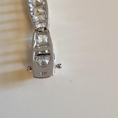 Sale Photo Thumbnail #267: This auction lot is for a Sterling Silver Bracelet.  This fashion bracelet is marked 925. It is decorated with nicely cut glass gems.  See photo for size.