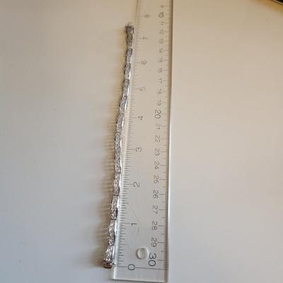 Sale Photo Thumbnail #264: This auction lot is for a Sterling Silver Bracelet.  This fashion bracelet is marked 925. It is decorated with nicely cut glass gems.  See photo for size.