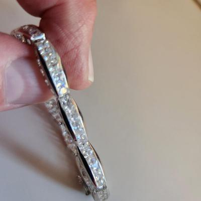 Sale Photo Thumbnail #263: This auction lot is for a Sterling Silver Bracelet.  This fashion bracelet is marked 925. It is decorated with nicely cut glass gems.  See photo for size.