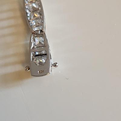 Sale Photo Thumbnail #266: This auction lot is for a Sterling Silver Bracelet.  This fashion bracelet is marked 925. It is decorated with nicely cut glass gems.  See photo for size.
