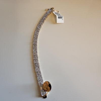 Sale Photo Thumbnail #277: This auction lot is for a Gold-Washed and Sterling Silver Bracelet.  This handsome bracelet has a backside of gold-wash and a front that sports a unique metalic design in sterling silver.  The bracelet is marked 925.  The bracelet is new and still has the