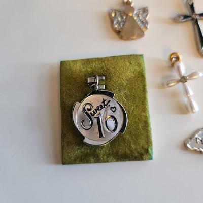 Sale Photo Thumbnail #280: This auction lot is for a Collection of Sterling Silver Charms & Crosses.  This is a fun grouping of small items.  The Sweet 16, Cozumel and pearl cross are not marked but we feel are precious.  The angel is marked 925 and the remaining two crosses are ma