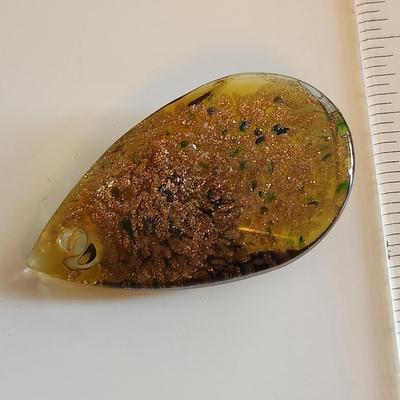 Sale Photo Thumbnail #287: This auction lot is for a Man-made Amber-Like Glass Pendant.  This handsome pendant is drilled and ready for a nice necklace to sport its beauty. See photo for size.