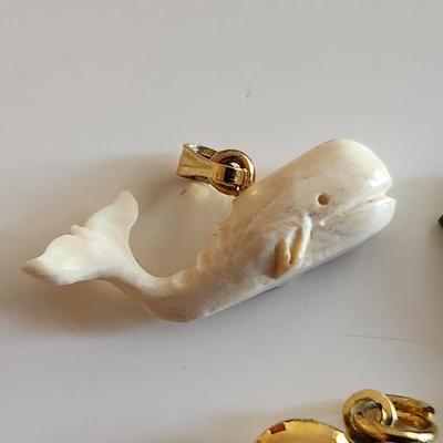 Sale Photo Thumbnail #289: This auction lot is for Four Sweet Charms.  This charms where in the bottom of a small dresser jewelry box in a recent estate. There is a small carved white whale, a carved stone turtle, a sea horse and a gold-tone heart locket in this group.