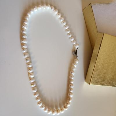 Sale Photo Thumbnail #298: This auction lot is for a Pearl Necklace. This necklace is made with cultured, hand-induced, natural pearls. This is a beautiful set of pearls - just perfect to accompany your little black dress.