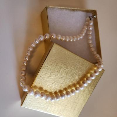 Sale Photo Thumbnail #294: This auction lot is for a Pearl Necklace. This necklace is made with cultured, hand-induced, natural pearls. This is a beautiful set of pearls - just perfect to accompany your little black dress.