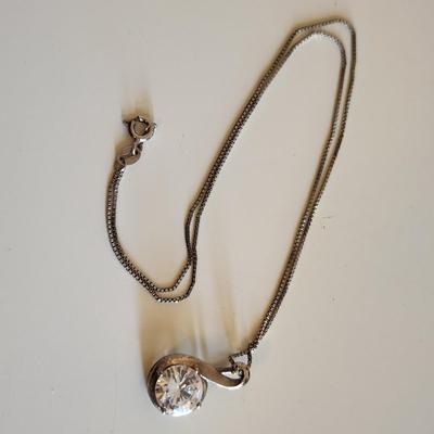 Sale Photo Thumbnail #310: This auction lot is for Four Sterling Silver Necklaces. Three necklace are marked 925.  There is a 16-inch necklace with a large cut glass stone, another 14-inch necklace with a pendant of silver overlay on jade stone, a very delicate 17-inch chain with a