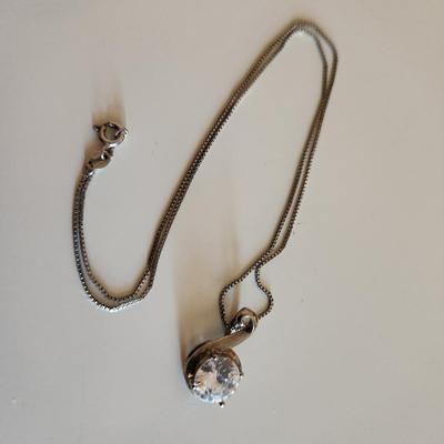 Sale Photo Thumbnail #307: This auction lot is for Four Sterling Silver Necklaces. Three necklace are marked 925.  There is a 16-inch necklace with a large cut glass stone, another 14-inch necklace with a pendant of silver overlay on jade stone, a very delicate 17-inch chain with a