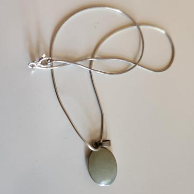 Sale Photo Thumbnail #320: This auction lot is for Four Sterling Silver Necklaces. Three necklace are marked 925.  There is a 16-inch necklace with a large cut glass stone, another 14-inch necklace with a pendant of silver overlay on jade stone, a very delicate 17-inch chain with a