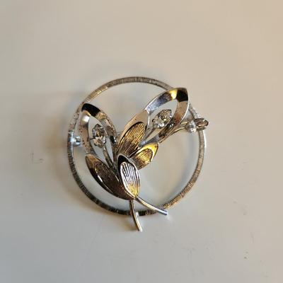 Sale Photo Thumbnail #323: This auction lot is for a Trio of Sterling Silver Jewelry.  This trio consists of a fancy pin with cut glass gems, a pair of sterling earrings with cut glass stones and a very nice 18-inch necklace with a drilled pearl as pendant.  All are marked 925.  Bu