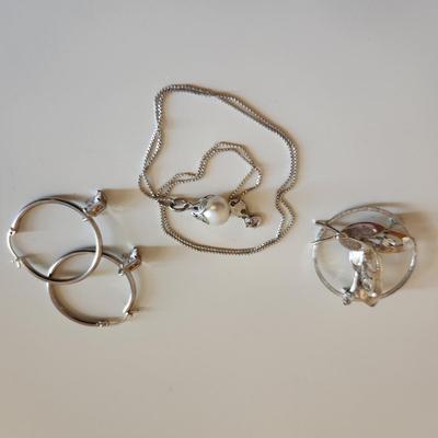 Sale Photo Thumbnail #329: This auction lot is for a Trio of Sterling Silver Jewelry.  This trio consists of a fancy pin with cut glass gems, a pair of sterling earrings with cut glass stones and a very nice 18-inch necklace with a drilled pearl as pendant.  All are marked 925.  Bu