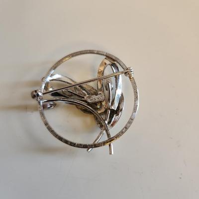 Sale Photo Thumbnail #324: This auction lot is for a Trio of Sterling Silver Jewelry.  This trio consists of a fancy pin with cut glass gems, a pair of sterling earrings with cut glass stones and a very nice 18-inch necklace with a drilled pearl as pendant.  All are marked 925.  Bu