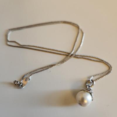 Sale Photo Thumbnail #326: This auction lot is for a Trio of Sterling Silver Jewelry.  This trio consists of a fancy pin with cut glass gems, a pair of sterling earrings with cut glass stones and a very nice 18-inch necklace with a drilled pearl as pendant.  All are marked 925.  Bu