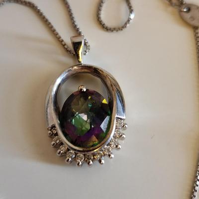 Sale Photo Thumbnail #332: This auction lot is for a set of Sterling Silver & Mystic Topaz Necklace and Earrings.  The necklace is about 18-inches long. The Mystic Topaz stones are clear and brilliant with the usual Aurora Borealis effect the stones have. All are marked 925.  What 