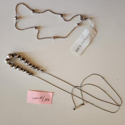 Sale Photo Thumbnail #336: This auction lot is for a collection of Jewelry with Sterling Silver Balls.  This offering includes a bracelet with original tag attached and two necklaces one measures 23-inches and the other 25-inches - both with cascading sterling silver balls. All are