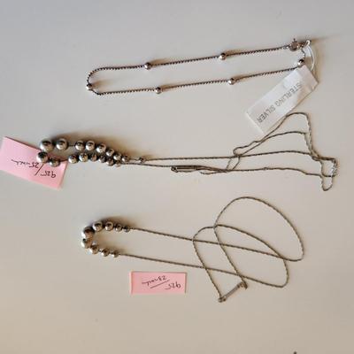 Sale Photo Thumbnail #338: This auction lot is for a collection of Jewelry with Sterling Silver Balls.  This offering includes a bracelet with original tag attached and two necklaces one measures 23-inches and the other 25-inches - both with cascading sterling silver balls. All are