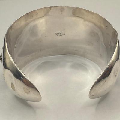 Sale Photo Thumbnail #755: Most likely Mid Century design.  Wide, non-flexible cuff.  Highly decorated with rosettes, hollow beads and floral motifs.  2.5" wide. A successful wire transfer is required if this item is to be shipped.  [RM]