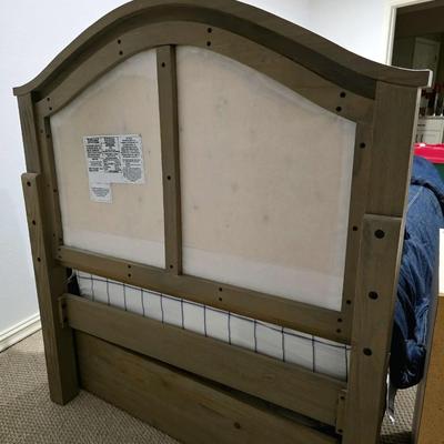 Sale Photo Thumbnail #296: Twin Trundle Bed #1 with mattresses. Driftwood color with natural colored upholstered headboard. SHEETS AND BEDDING (comforter, pillow, sham, sheets, & blanket) ARE NOT INCLUDED, The nightstand you see in the photograph is also NOT included. Note that the