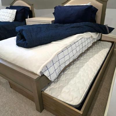 Sale Photo Thumbnail #289: Twin Trundle Bed #1 with mattresses. Driftwood color with natural colored upholstered headboard. SHEETS AND BEDDING (comforter, pillow, sham, sheets, & blanket) ARE NOT INCLUDED, The nightstand you see in the photograph is also NOT included. Note that the