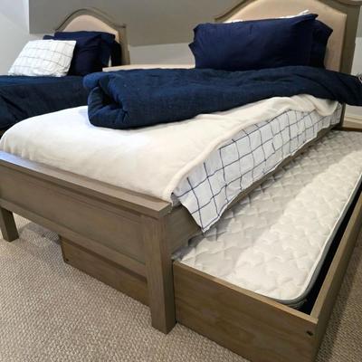 Sale Photo Thumbnail #290: Twin Trundle Bed #1 with mattresses. Driftwood color with natural colored upholstered headboard. SHEETS AND BEDDING (comforter, pillow, sham, sheets, & blanket) ARE NOT INCLUDED, The nightstand you see in the photograph is also NOT included. Note that the