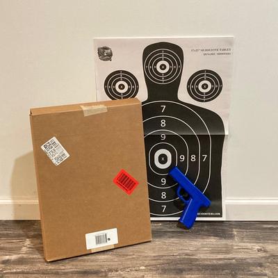 LOT 29: LaserLyte LT-TTL 008821 Trigger Blue Pistol with Built In Laser and Box of Dynamic Shooters Paper Shooting Targets
