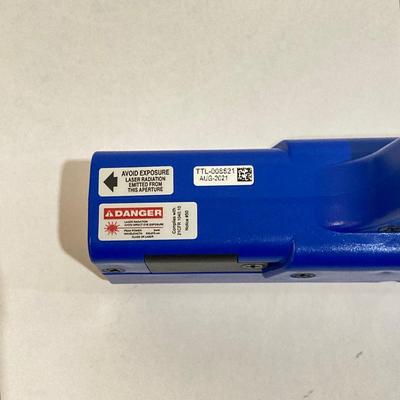 LOT 29: LaserLyte LT-TTL 008821 Trigger Blue Pistol with Built In Laser and Box of Dynamic Shooters Paper Shooting Targets