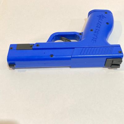 LOT 29: LaserLyte LT-TTL 008821 Trigger Blue Pistol with Built In Laser and Box of Dynamic Shooters Paper Shooting Targets