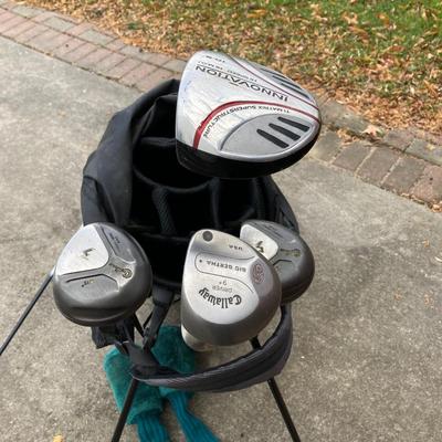 LOT 33: Collection of Golf Clubs and Accessories - Taylor Made, Callaway, Ram, Vesuvius Ceramic Putter with Ogio Golf Bag