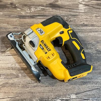 LOT 81: DeWalt Cordless Tools - Circular Saw DCS391, Jig Saw DCS334, Battery, Compact Stapler and Storage Bag