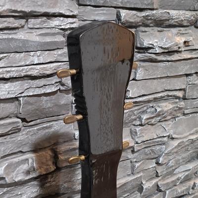 LOT 115: Vintage Guitar-Shaped CD Stand