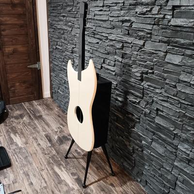 LOT 115: Vintage Guitar-Shaped CD Stand