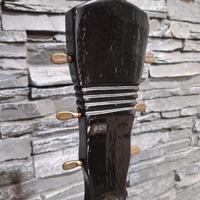 LOT 115: Vintage Guitar-Shaped CD Stand