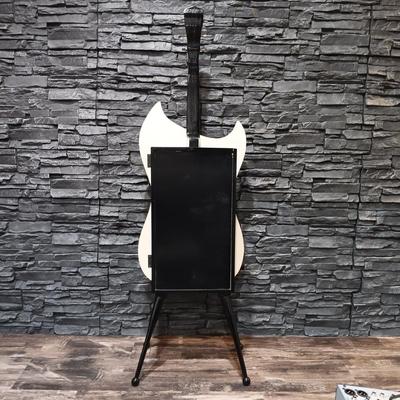 LOT 115: Vintage Guitar-Shaped CD Stand