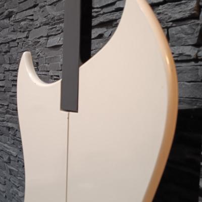 LOT 115: Vintage Guitar-Shaped CD Stand