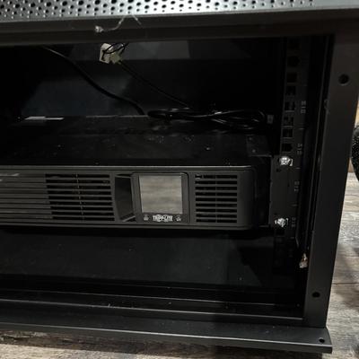 LOT 148: Pure Sign Tripp Light Uninterruptible SMART1500LCD 1500VA Rack Mount UPS Battery Backup, 900W, in cooling rack