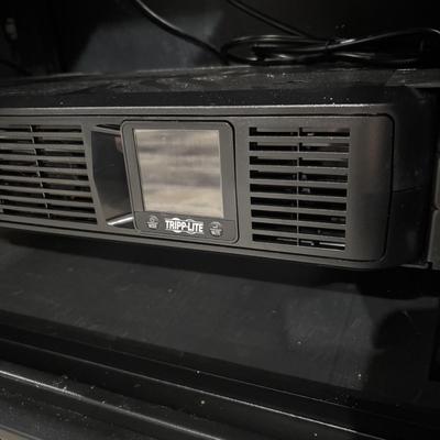 LOT 148: Pure Sign Tripp Light Uninterruptible SMART1500LCD 1500VA Rack Mount UPS Battery Backup, 900W, in cooling rack