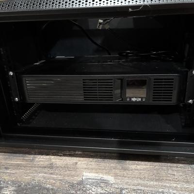 LOT 148: Pure Sign Tripp Light Uninterruptible SMART1500LCD 1500VA Rack Mount UPS Battery Backup, 900W, in cooling rack