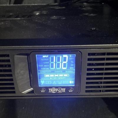 LOT 148: Pure Sign Tripp Light Uninterruptible SMART1500LCD 1500VA Rack Mount UPS Battery Backup, 900W, in cooling rack