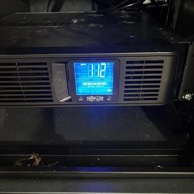 LOT 148: Pure Sign Tripp Light Uninterruptible SMART1500LCD 1500VA Rack Mount UPS Battery Backup, 900W, in cooling rack