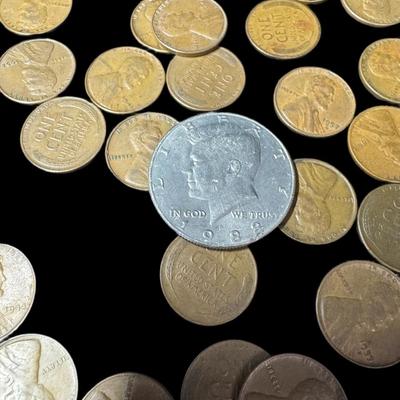 Sale Photo Thumbnail #764: Includes 58 Lincoln cents from the 1920s to the 1950s, two Kennedy half dollars, and two flattened (souvenir) pennies. Total of 62 pieces. [RM]