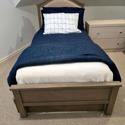 Sale Photo Thumbnail #304: Twin trundle bed # .with mattresses. Driftwood color with natural colored upholstered headboard. SHEETS AND BEDDING (comforter, pillow, sham, sheets, & blanket) ARE NOT INCLUDED, The nightstand you see in the photograph is also NOT included. Note that the