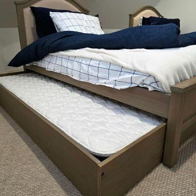 Sale Photo Thumbnail #309: Twin trundle bed # .with mattresses. Driftwood color with natural colored upholstered headboard. SHEETS AND BEDDING (comforter, pillow, sham, sheets, & blanket) ARE NOT INCLUDED, The nightstand you see in the photograph is also NOT included. Note that the
