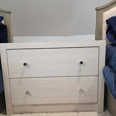 Sale Photo Thumbnail #319: This is a pair of two modern lightwood colored veneer nightstands. Each has some flaws as shown in the photos. Please zoom in on each picture for details. They measure 35"L X 17"D x 26"H. You are bidding on both, meaning you must pay for and take both nig