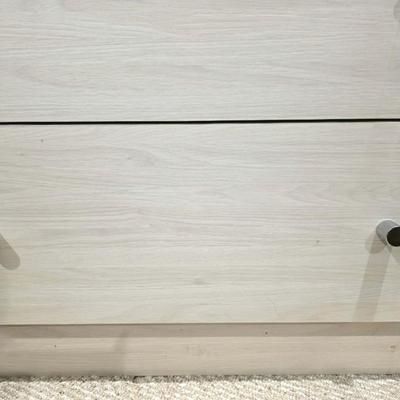 Sale Photo Thumbnail #327: This is a pair of two modern lightwood colored veneer nightstands. Each has some flaws as shown in the photos. Please zoom in on each picture for details. They measure 35"L X 17"D x 26"H. You are bidding on both, meaning you must pay for and take both nig