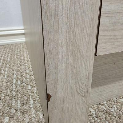 Sale Photo Thumbnail #320: This is a pair of two modern lightwood colored veneer nightstands. Each has some flaws as shown in the photos. Please zoom in on each picture for details. They measure 35"L X 17"D x 26"H. You are bidding on both, meaning you must pay for and take both nig